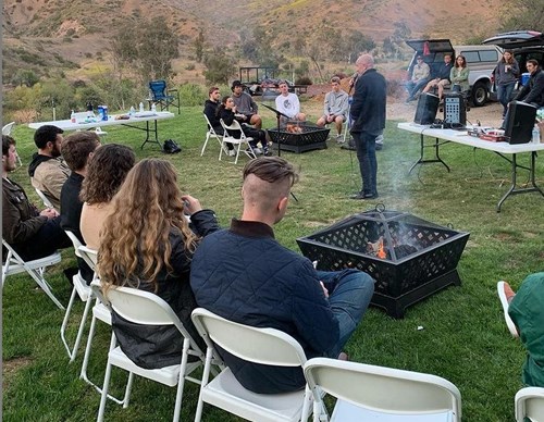 CUI Bono hosted at retreat with bonfire